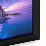Framed canvas depicting Cinque Terre with textured, colorful art in black frame, ideal for large living room walls.
