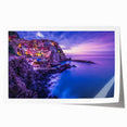 Rolled print of Cinque Terre with pastel colored buildings and calm sea, suited for dining room wall art.