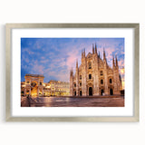Extra large abstract art print of Milan scenery in muted earth tones on a textured canvas, framed in silver.