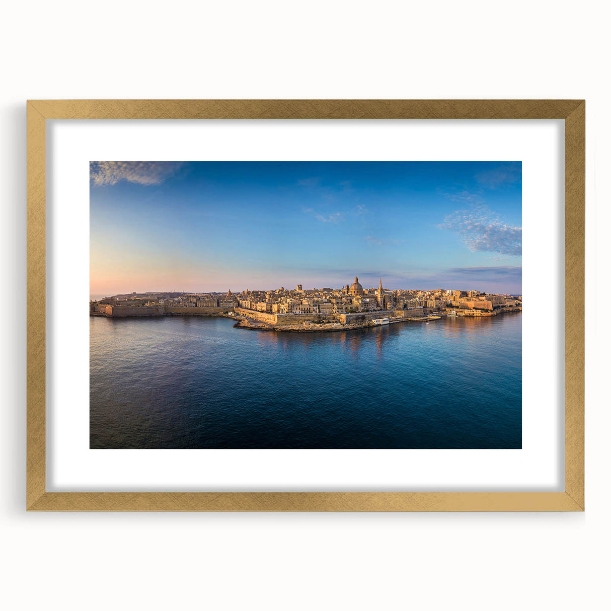 Abstract art print of a European Malta scenery in muted blue and cream tones, framed in gold, ideal for dining room decor.