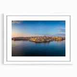 Textured abstract print of Malta scenery in muted earth tones, framed with a white mat, suitable for bedroom art.