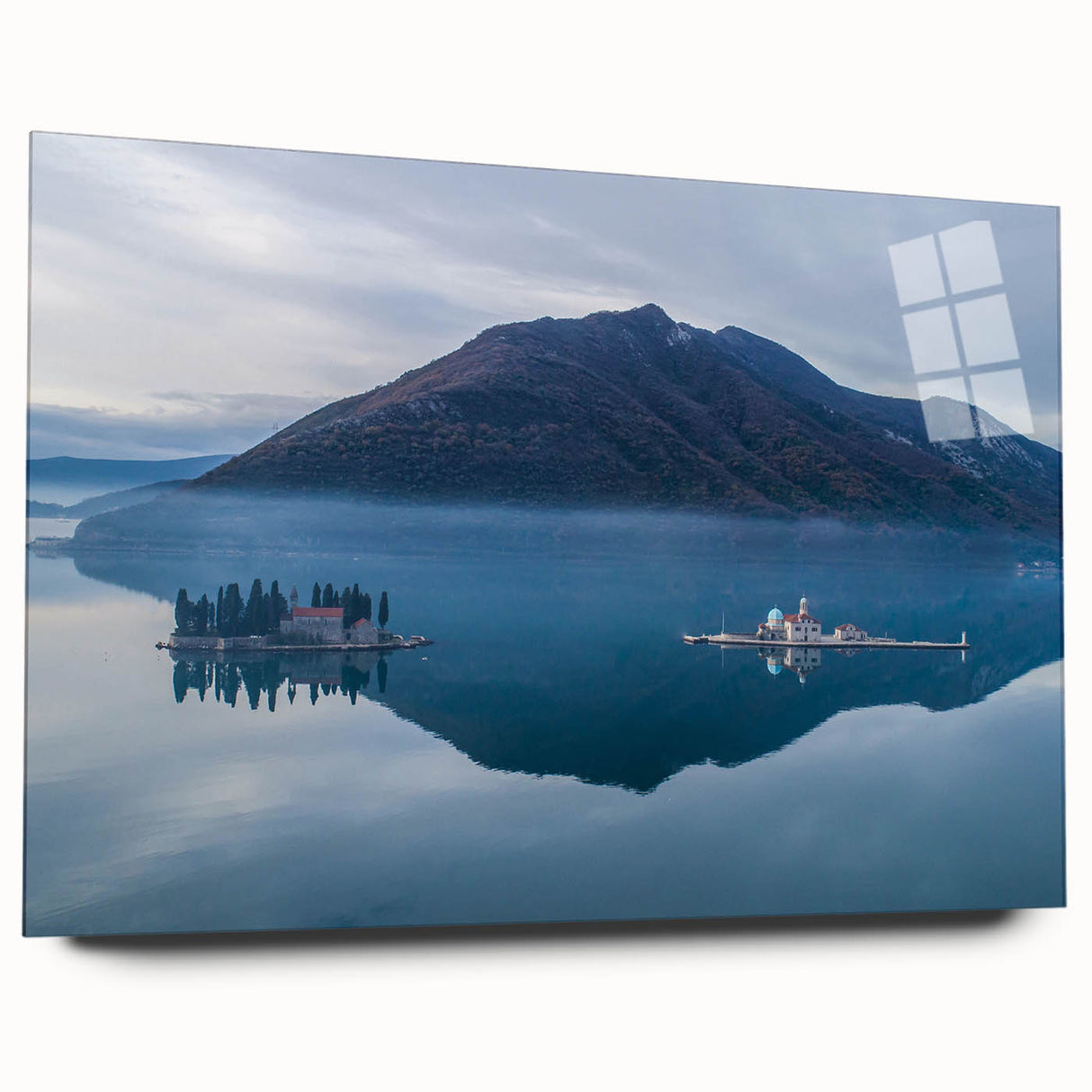 Large abstract wall art of a Montenegro landscape in muted blues and greens on acrylic glass.