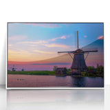 Mid-century modernist art depicting a serene European landscape in muted greens and blues on a framed acrylic.