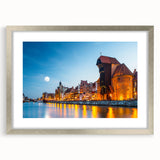 Extra large abstract art print of a European scenery in textured shades of blue and green, framed with a silver mat.