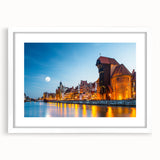 Textured art print of a European cityscape in muted gray and blue tones, framed with a white mat.