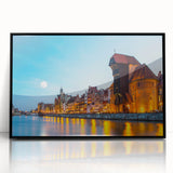 Large abstract wall art depicting a stylized European cityscape in muted gray and blue tones on a framed acrylic.