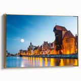 Framed canvas featuring a vintage-style landscape painting of a European scenery in black and gold tones.