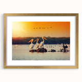 Abstract art print of a European landscape in muted gold and green tones, framed with a gold mat.