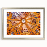 Textured abstract art print of Madrid scenery in muted earth tones, displayed in a silver frame with mat.