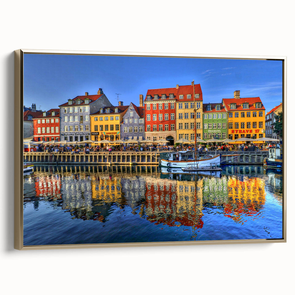 Framed canvas wall art featuring a vintage-style landscape painting of Stockholm in muted gold and black tones.