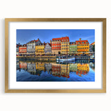 Extra large abstract art print of Stockholm's scenery in textured shades of blue and gray, framed in gold.
