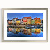 Textured abstract art print of Stockholm scenery in muted blue and gray tones, framed with a silver mat.