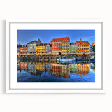 Abstract art print of Stockholm scenery in muted blue and gray tones on a white framed canvas, great for dining room decor.