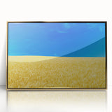 Large art print of a serene Ukrainian landscape in muted earth tones, framed in gold acrylic.