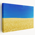 Side view of a stretched canvas featuring a serene Ukrainian landscape in soft green and blue tones.