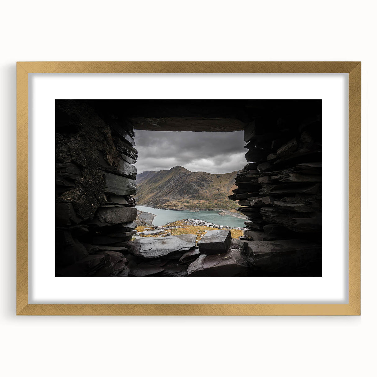 Extra large abstract art print of a Welsh scenery in gold frame with mat, featuring textured brush strokes in earth tones.
