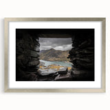 Textured art depicting an abstract Welsh landscape in muted earth tones, framed with a silver mat, ideal for bedroom decor.