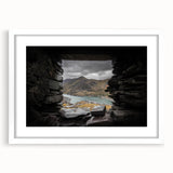 Abstract art print depicting a serene Welsh landscape in muted green and blue tones, framed with a white mat.