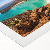 Art deco poster of Baja California scenery on rolled canvas, featuring pastel blue and pink tones.