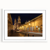 Abstract art print of Mexico City in muted gray and blue tones on a framed white mat, ideal for dining room decor.
