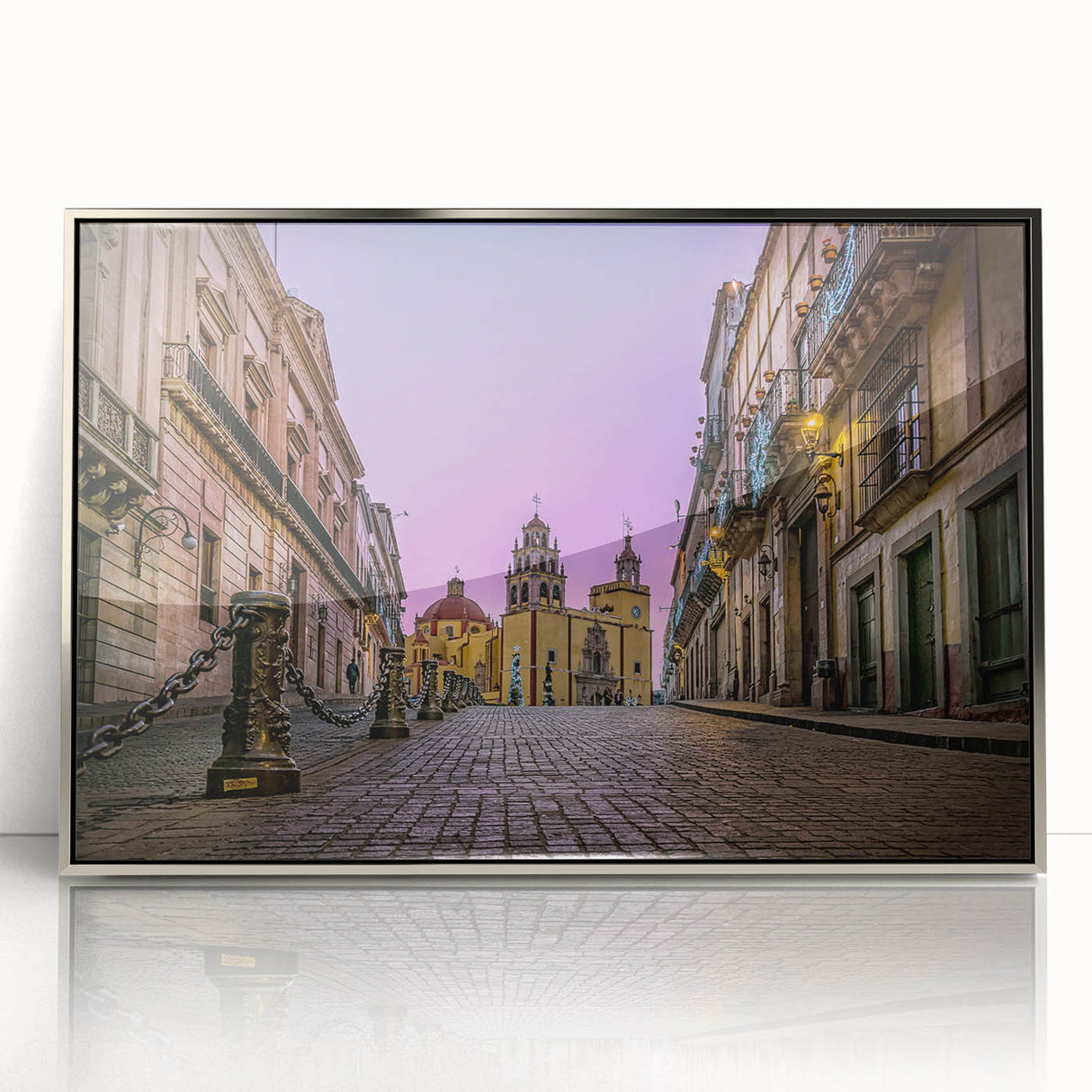 Mid-century modernist art depicting the colorful streets of Guanajuato on a silver-framed acrylic print.