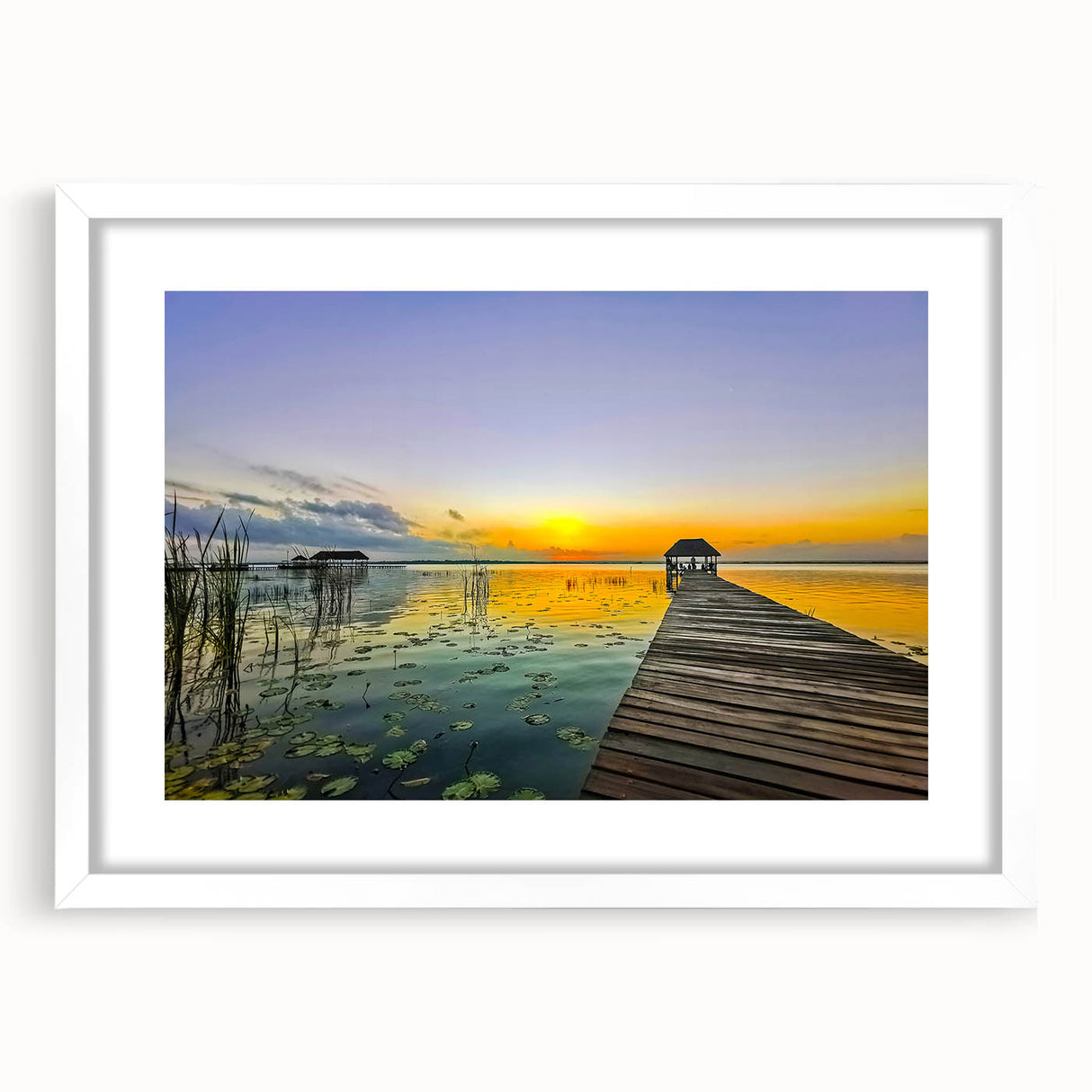 Abstract art print of Quintana Roo scenery in muted blue and green tones, framed with a white mat.
