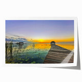 Rolled canvas print of Quintana Roo scenery with lush greenery and a serene lake, in vibrant greens and blues.