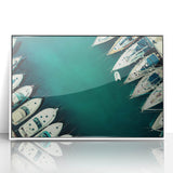 Acrylic print of Dubai skyline in muted metallic tones, framed in white, suitable for modern art wall decor.