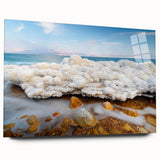 Large abstract wall art of the Dead Sea in muted blue and beige tones on acrylic glass.
