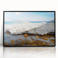 Large abstract wall art depicting the Dead Sea in muted blue and gray tones, framed in black acrylic.