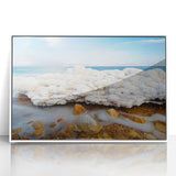 Modern art wall decor depicting the Dead Sea in muted blues and whites on a framed acrylic print.