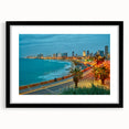Extra large abstract art print of Tel Aviv skyline in vibrant colors on a textured canvas, framed with a black mat.