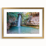 Extra large abstract art print of a Middle Eastern scenery in muted earth tones on a textured canvas, framed in gold.