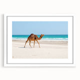 Abstract art print of a Middle Eastern landscape in muted earth tones on a white-framed canvas.