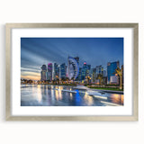 Textured abstract art print of a Middle Eastern scenery in muted earth tones on a silver-framed canvas.