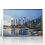 Art deco poster of Qatar scenery in muted beige and blue tones, acrylic print framed in white.