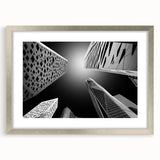 Textured abstract art print depicting a stylized Saudi Arabian landscape in muted earth tones, framed in silver.