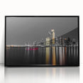 Large abstract wall art depicting the Abu Dhabi skyline in muted gray and blue tones, framed in black acrylic.