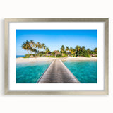 Textured abstract art print of oceanic scenery in muted blue tones, framed in silver, ideal for bedroom decor.