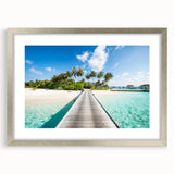 Textured art print of an abstract ocean scene in shades of blue and turquoise on a silver-framed canvas.