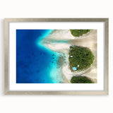 Textured abstract art print of Micronesia scenery in muted blue and green, framed in silver, ideal for bedroom decor.
