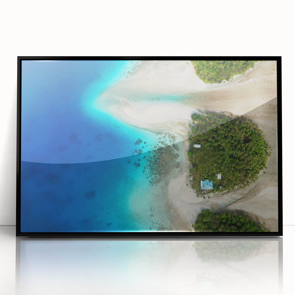 Large abstract wall art depicting a serene Micronesian ocean scene in blue tones, framed in black acrylic.