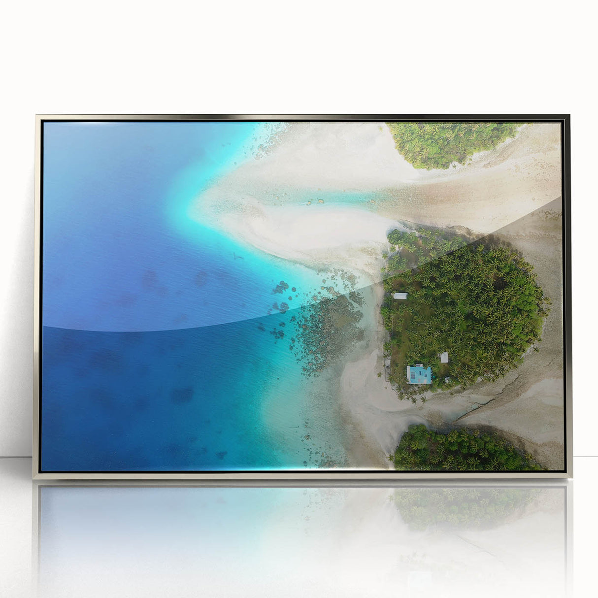 Mid-century modernist art depicting Oceania's coastal scene in cool blue shades, silver-framed acrylic.