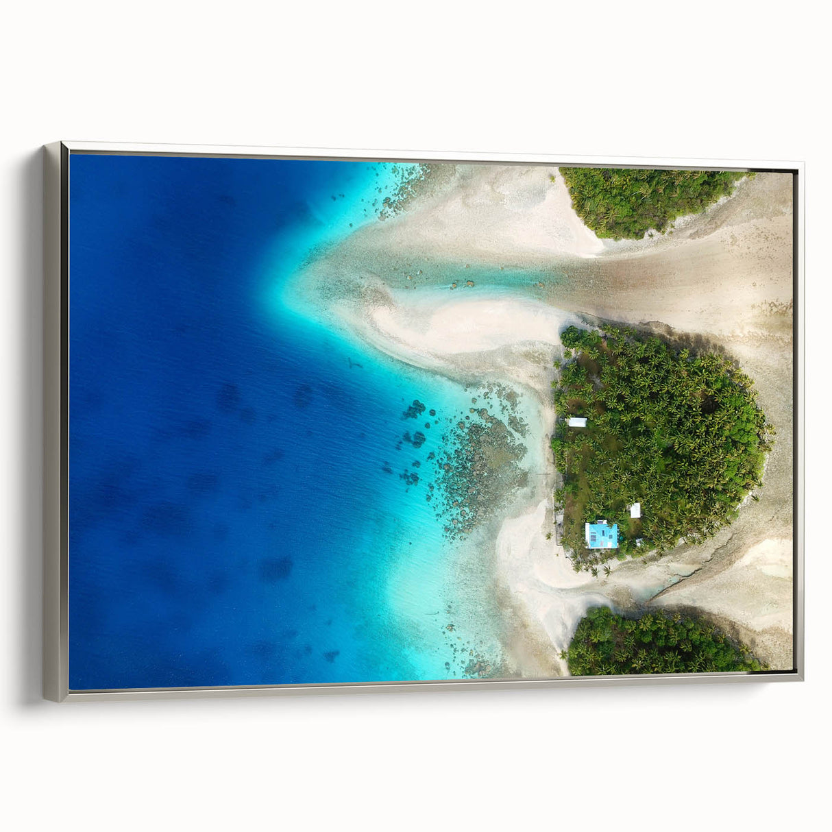 Vintage poster art of Oceania scenery in colorful hues on a silver-framed canvas, ideal for living room decor.