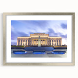 Textured abstract art print depicting the Auckland skyline in muted blue tones on a silver-framed canvas.