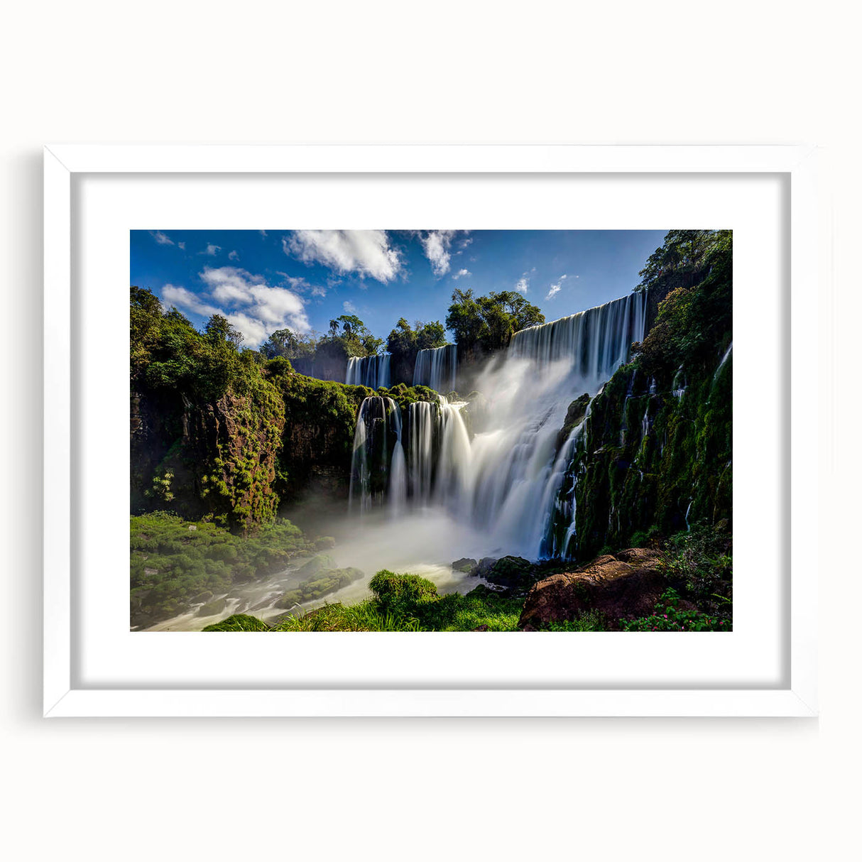 Abstract art print of a Brazilian landscape in muted green and blue tones on a framed white mat, ideal for dining room decor.
