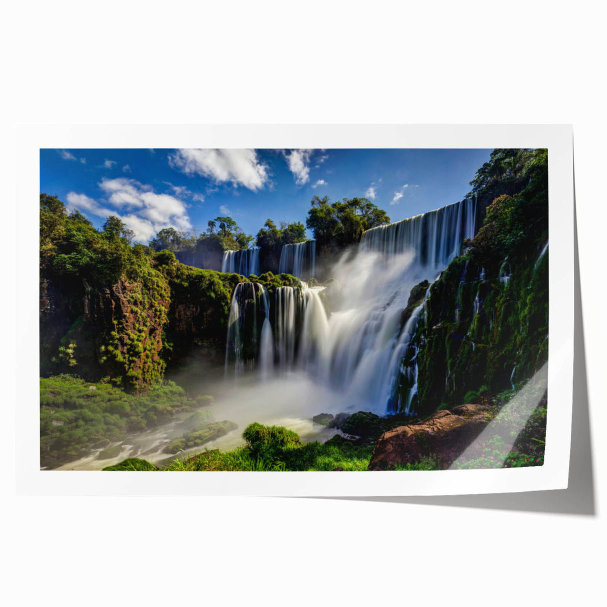 Rolled print of a Brazilian landscape featuring lush greenery and distant mountains, in soft earth tones.