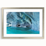 Textured abstract art print of a Chilean landscape in muted earth tones, framed in silver, ideal for bedroom wall decor.