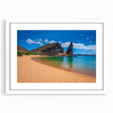 Abstract art print of Galapagos scenery in muted earth tones on a white framed mat, suitable for dining room decor.