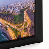 Black wall art featuring a textured depiction of a Peruvian landscape on a framed canvas, with vibrant, colorful details.